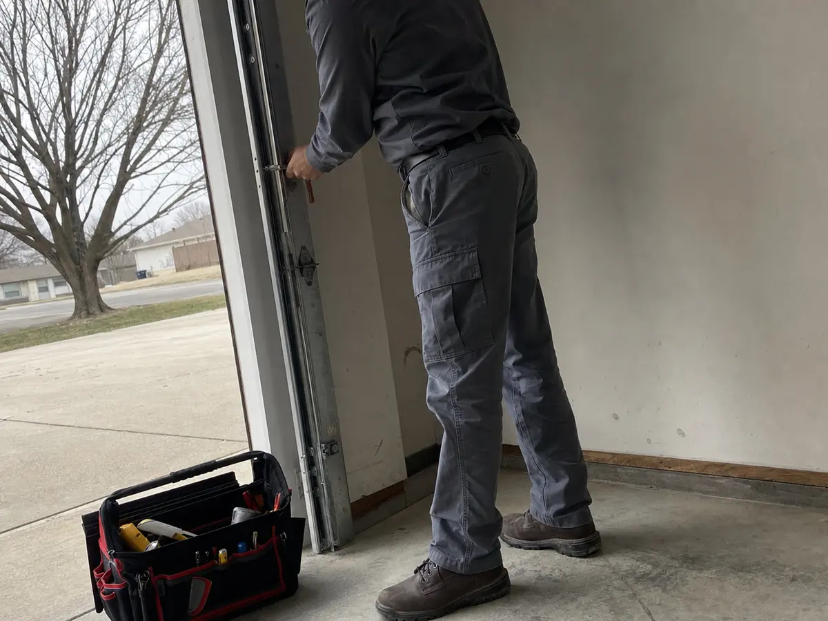 Garage Door repair technician on the job in Southlake, TX